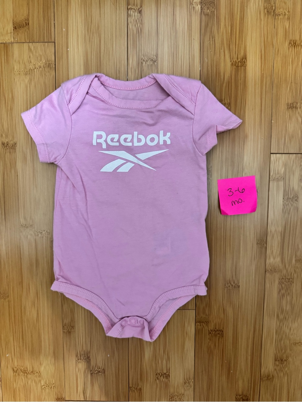Reebok Light Pink Baby One-Piece Bodysuit with White Logo